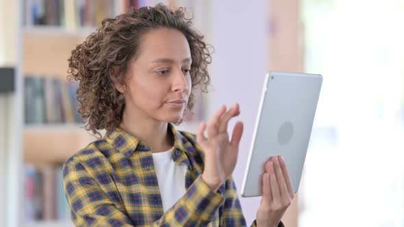 Portrait of Mixed Race Woman Using Digital Tablet