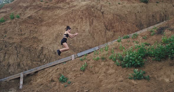 A Young Attractive Girl Does Her Workout of Jumps