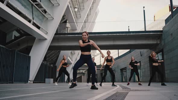 Close Up Portrait of Diverse Group of Six Stylish Professional Dancers Performing a Zumba Dance