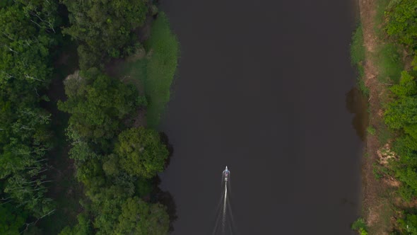 The Boat Floats on the River in the Jungle