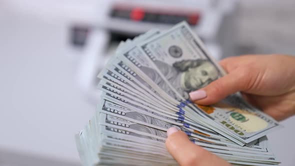 woman hands counting us dollar money