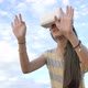 Slow motion 4K of Asian girl having fun with virtual reality glasses while standing over the sky. - VideoHive Item for Sale